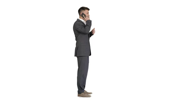 スーツ姿のビジネスマンが白い背中の携帯電話と話してる — ストック写真