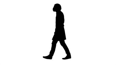 Siluet yürüyen doktor tıbbi maske takıyor..