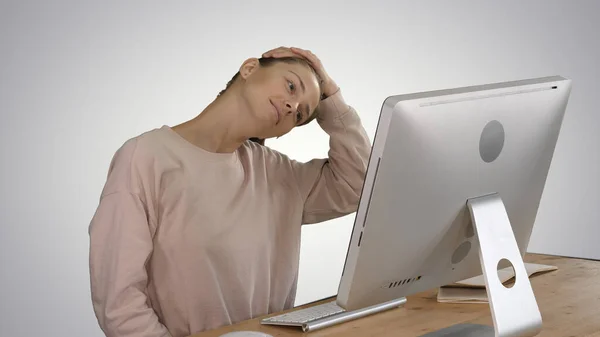 Exhausted young female sit at home office desk massaging neck on — Stock Photo, Image