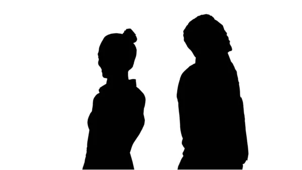 Silhouette Young African American man and woman standing back to — Stock Photo, Image