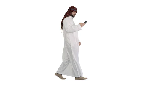 Arab man using his smartphone surfing on the internet or messagi — Stock Photo, Image