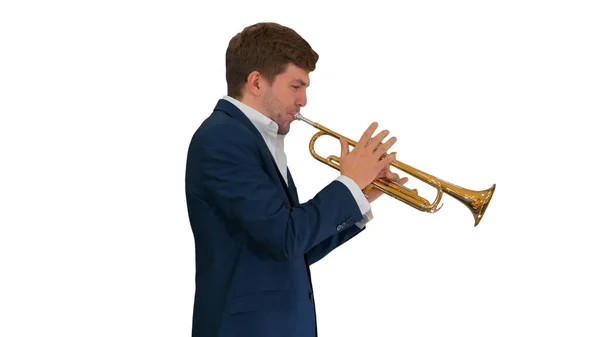 Young man in suit playing a trumpet while walking on white backg — Stock Photo, Image