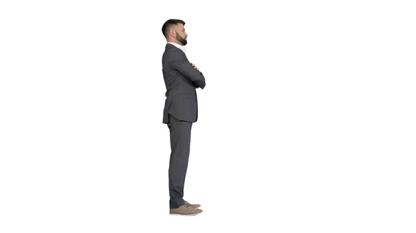 Selbstbewusster Geschäftsmann mit Bart und Schnurrbart im Anzug mit gefalteten Händen auf weißem Hintergrund. — Stockfoto