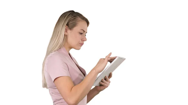 Girl holding digital tablet searching for something on white bac — Stock Photo, Image