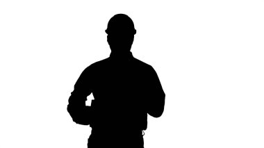 Siluet Genç, mutlu mühendis, miğfer takıyor..