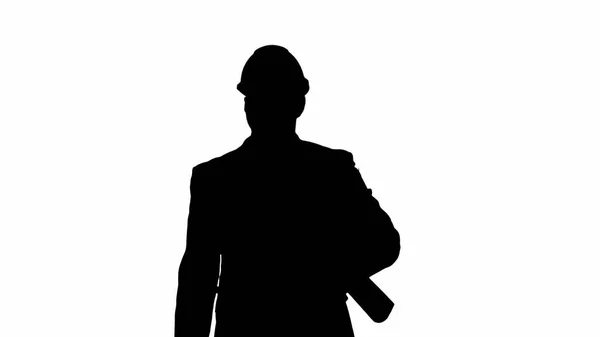 Silhouette Male architect in a suit and hard hat walking with bl — Stock Photo, Image