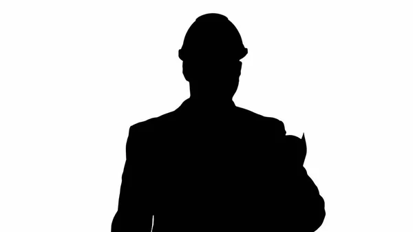 Silhouette Smiling architect or engineer walking while keeping p — Stock Photo, Image