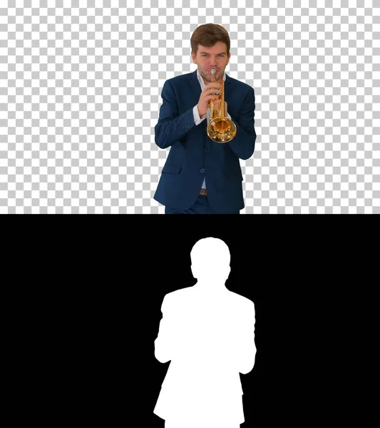 Young man in suit playing a trumpet while walking, Alpha Channel — Stock Photo, Image