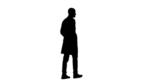 Silhouette Walking doctor in a robe. — Stock Photo, Image