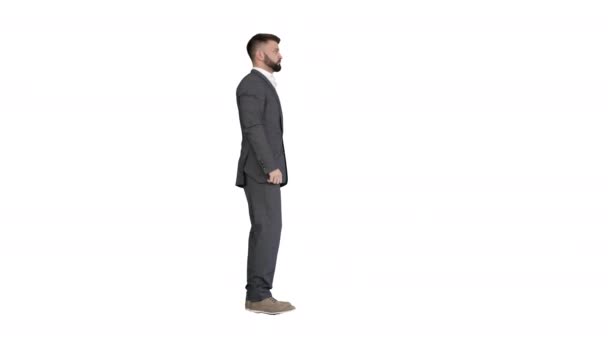 Homme d'affaires avec une barbe montrant des gestes Doigt levé, pouces levés sur fond blanc. — Video