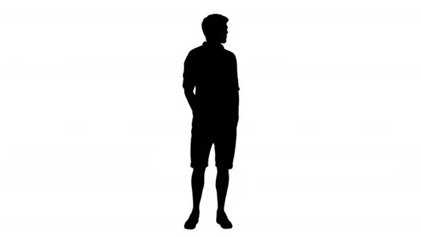 Silhouet Casual jongeman kijken naar de zijkant en praten over iets. — Stockvideo