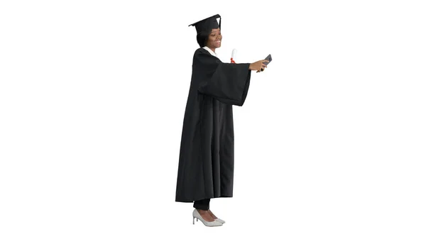 Happy African American female graduate holding diploma and makin — Stock Photo, Image