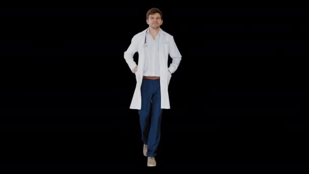 Männlicher Arzt im weißen Mantel geht mit den Händen in den Taschen geradeaus, Alpha Channel — Stockvideo