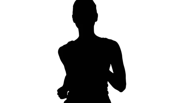 Siluet beyaz atletli genç kadın koşuyor. — Stok fotoğraf