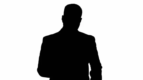 Silhouette Serious worried businessman trying to call someone an — Stock Photo, Image