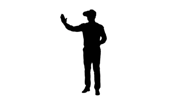 Silhouette Businessman i VR-glass og samspill med virtuelle virkelighetsobjekter. – stockfoto