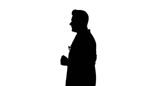 Silhouette Walking male doctor passing by. — Stock Photo, Image