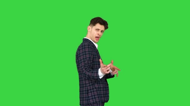 Cool attractive businessman does different defiant gestures on a Green Screen, Chroma Key. — Stock Video