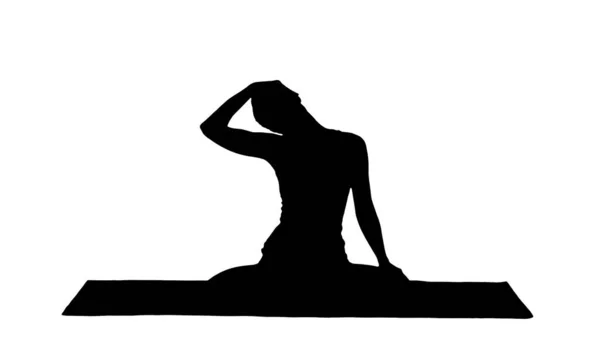 Silhouette Femme paisible pratiquant le yoga, assise dans la pose du lotus — Photo