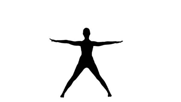 Silhueta jovem mulher em frente dobra asana ioga pose. — Fotografia de Stock