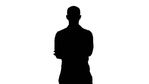 Silhouette Serious confident arabian man in casual folds hands looking into camera. — Stock Photo, Image