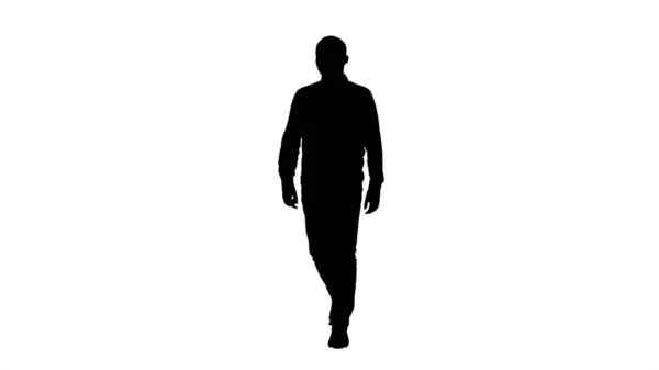 Silhouette Young man walking in a good mood. — Stock Photo, Image