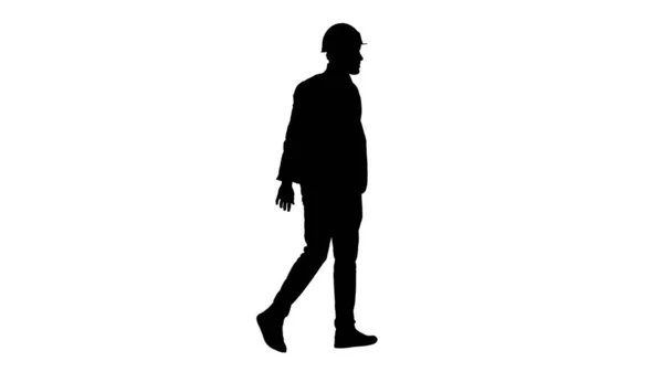 Engenheiro árabe silhueta com chapéu duro andando. Conceito de segurança. — Fotografia de Stock