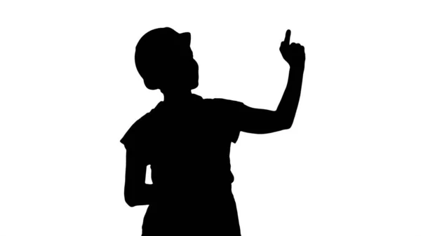 Silhouette Young smiling Worker woman pointing on imaginary butt — Stockfoto