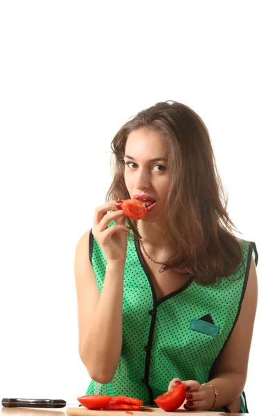 Young Girl Dressed Green Apron Eating Tomato — Stock Photo, Image