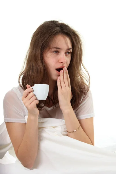 Young Woman Sitting Bed Cup Coffee Yawn Royalty Free Stock Images