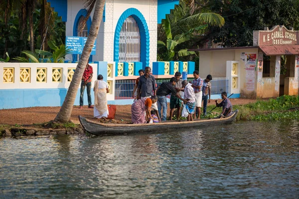 KOCHIN, INDIA-FEBRUARY 23: Hindu on the boat on February 23, 2013 in Kochin, India. Hindu man go by boat suburb of Cochin