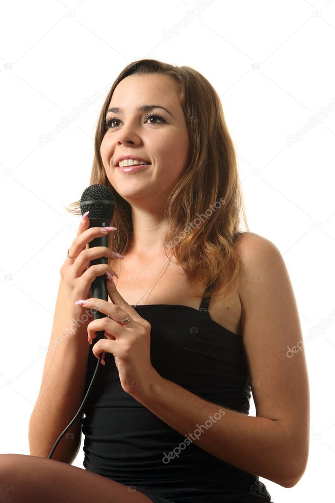 Young attractive girl on the white isolated background  singing.