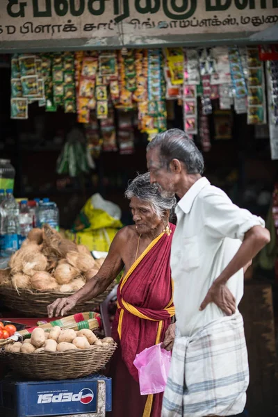 MADURAI, INDIA-FEBRUARY 15: Trader on the street of Indian town on February 15, 2013 in Madurai, India. Trader on a city street province Tamil Nadu