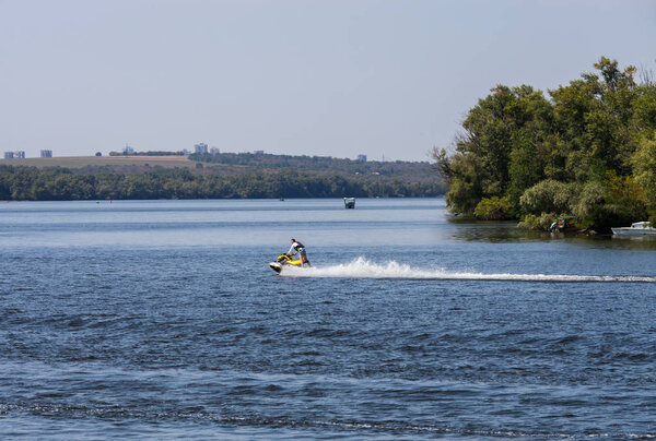 ZAPOROZHYE, UKRAINE-AUGUST 11: Motorboat 11, 2012 in Zaporozhye, Ukraine. Motorboat on the Dnieper River on the background of the island Khortytsya near the city Zaporozhye.