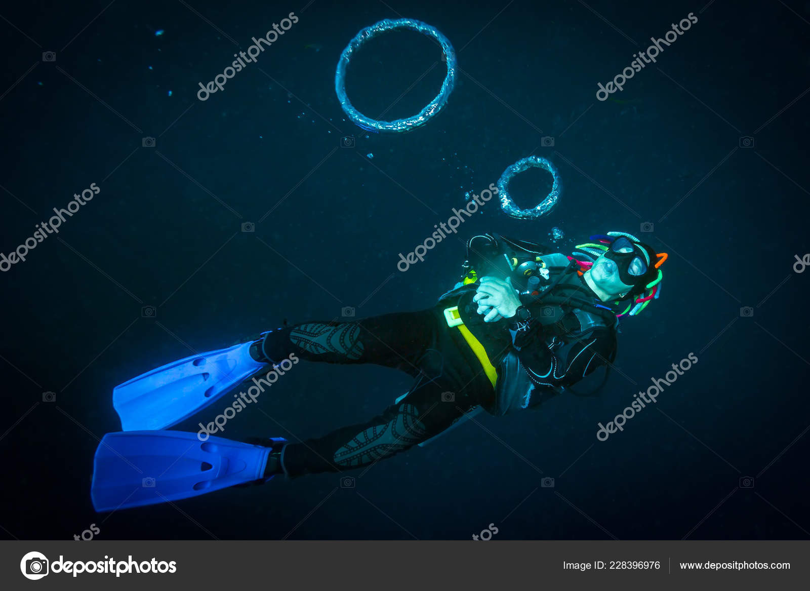 Scuba Diver Blows Air Rings — Stock Photo © sergemi 228396976