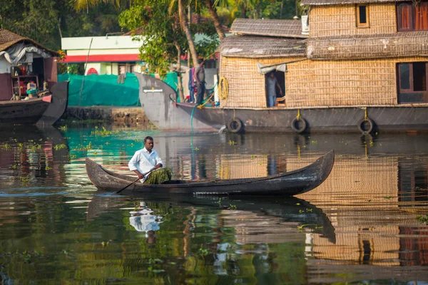 KOCHIN, INDIA-FEBRUARY 24: Hindu on the boat on February 24, 2013 in Kochin, India. Hindu man go by boat suburb of Cochin