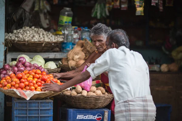 MADURAI, INDIA-FEBRUARY 15: Trader on the street of Indian town on February 15, 2013 in Madurai, India. Trader on a city street province Tamil Nadu