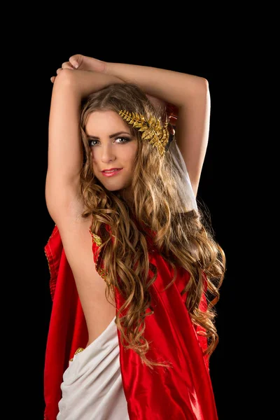 Ancient godndess in a red greece toga isolated on a black background