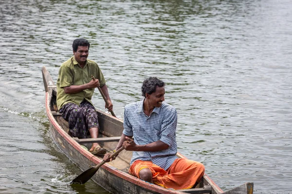 KOCHIN, INDIA-FEBRUARY 23: Hindu on the boat on February 23, 2013 in Kochin, India. Hindu man go by boat suburb of Cochin