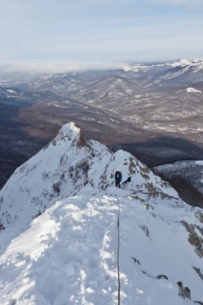 Hikers in snowy Crimea mountains