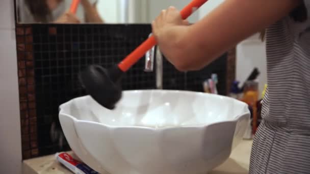 Plunger trying to remove clogged sinks — Stock Video