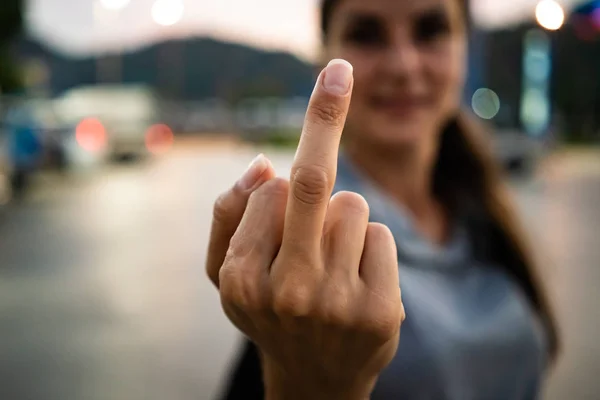 Young Woman Showing Fuck You Finger Sign.