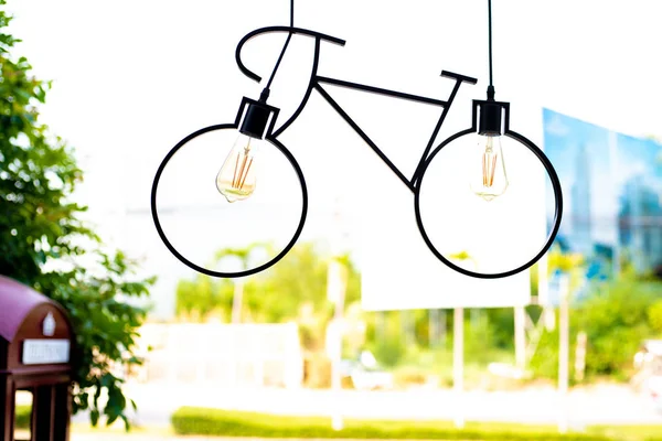 Ceiling lamp. Light fixture made in the shape of a bicycle.