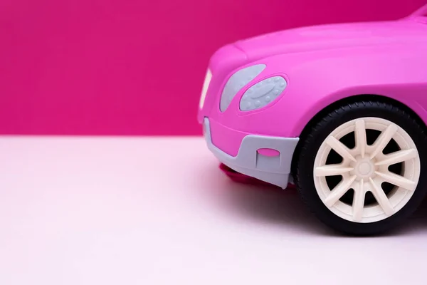 pink car on a pink background. Concept of car sale, car rental or car rental.