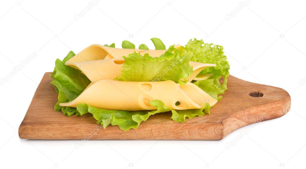 Cheese slices on green salad leaves isolated on white background