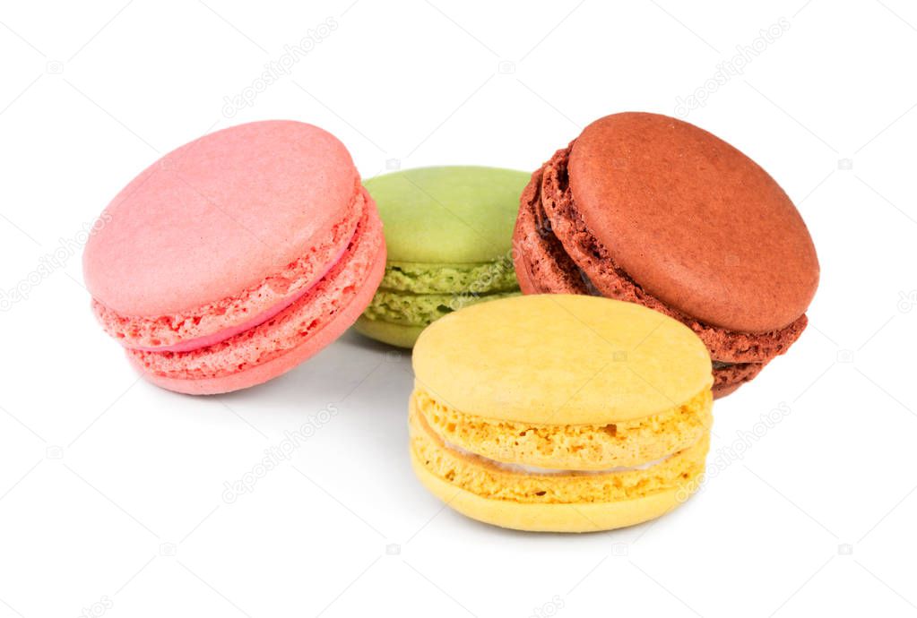 Four multicolored pastry macaron dessert isolated on white background