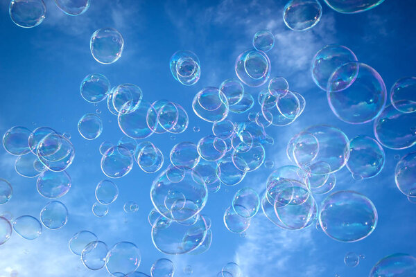 Soap bubble in the air with blue sky
