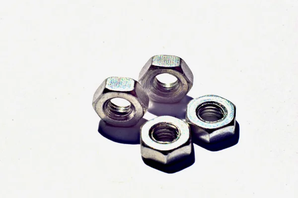 White Table Four Nuts Bolts High Quality Photo — Stock Photo, Image