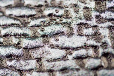 İmitasyon tuğla ile parlak kapanımlar suni taş altında yakın çekim. Arka plan