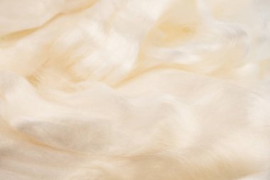 İpek lifleri, dekoratif yün doku. İnci renk arka plan ekran koruyucu, closeup merinos